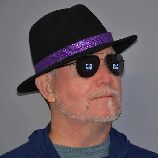 A man with a purple hat and sunglasses.